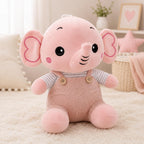Pink elephant plush toy wearing ribbed overalls and a striped shirt