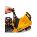 Close-up of yellow ride-on excavator toy seat and steering wheel with black console