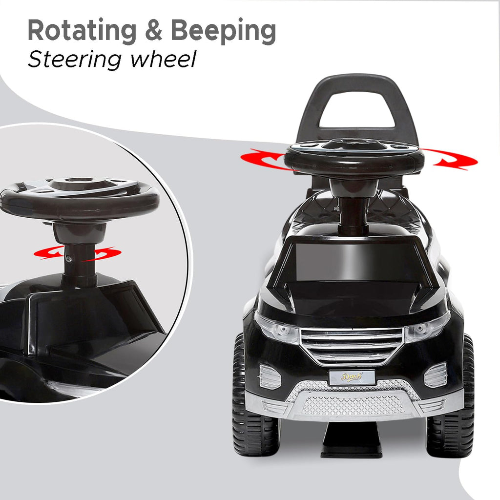 Black kids ride-on push car front view with rotating, beeping steering wheel