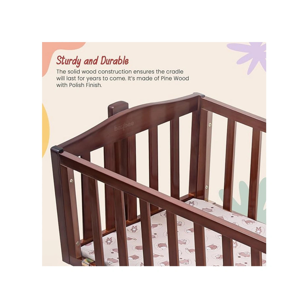 Wooden baby cradle with swing feature