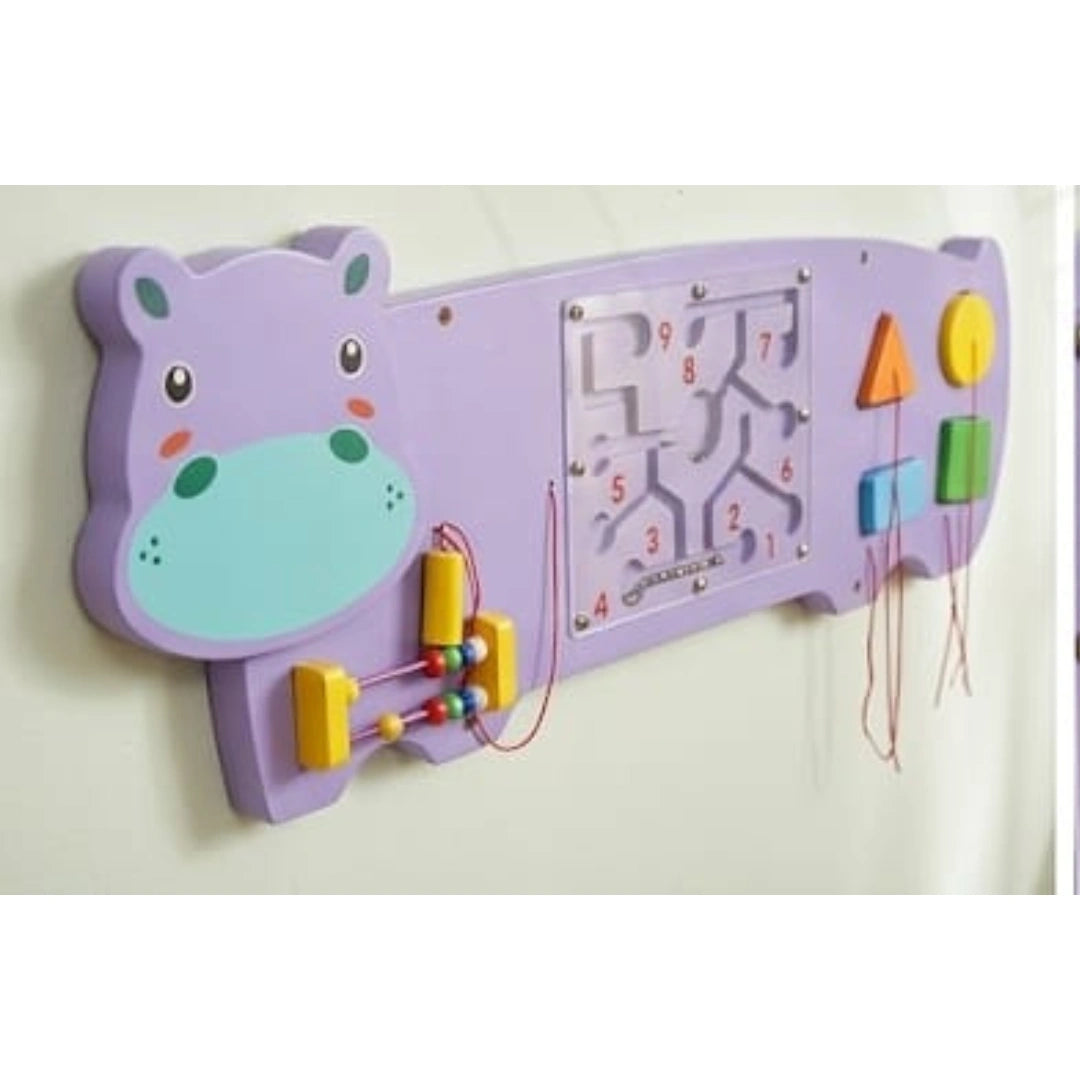 Kids playing wooden hippo activity board