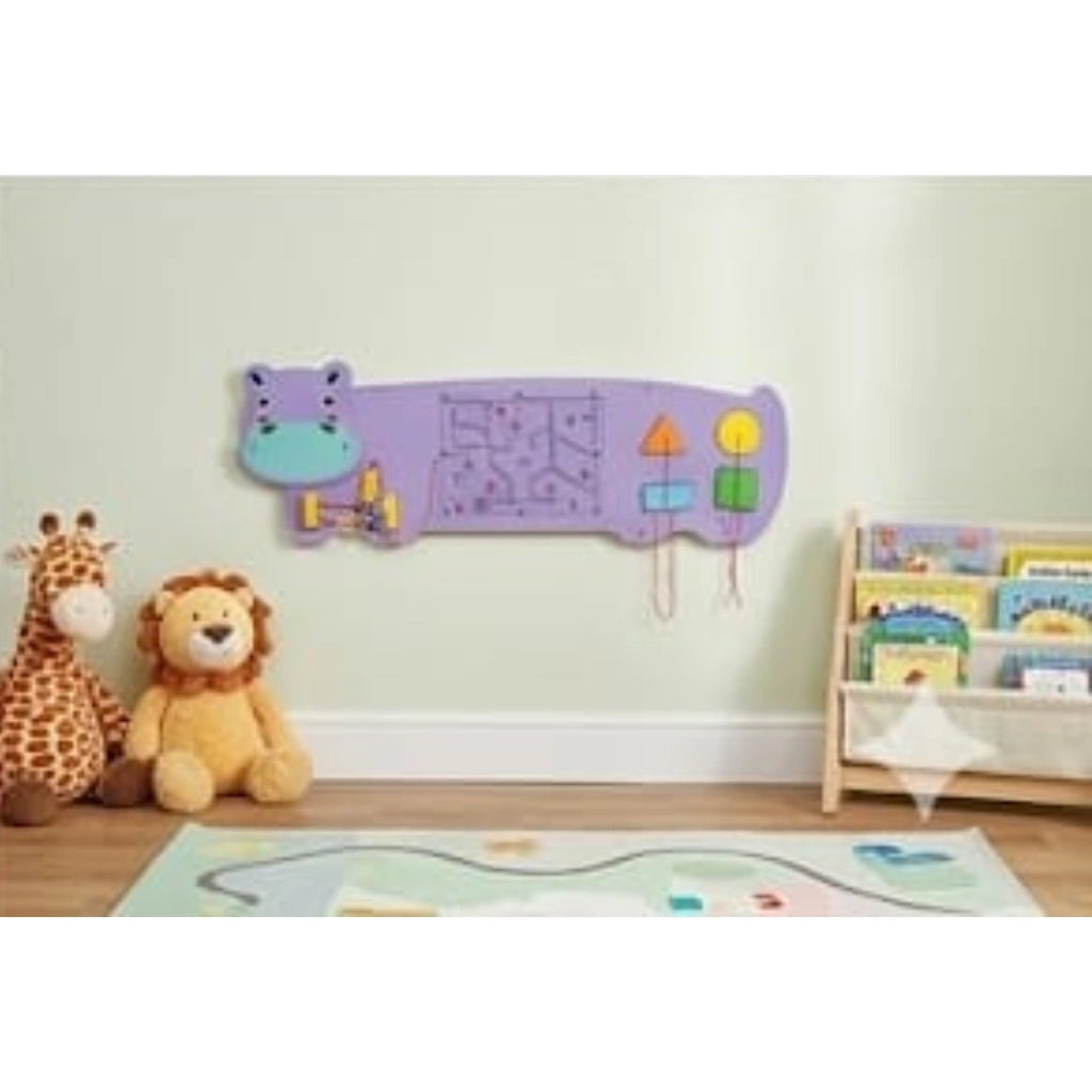 Kids playing wooden hippo activity board