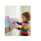 Kids playing wooden hippo activity board