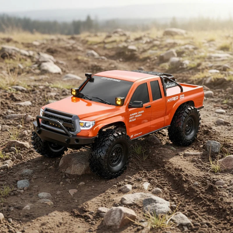 Orange RC rock crawler truck with black grille and roof roll bar, off-road tires