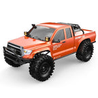 Orange RC rock crawler truck 3/4 front view with winch bumper and roof roll bar