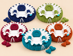Set of round baby nest beds with mosquito nets in blue, green, red, orange