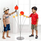 Children playing ping pong practice with red paddles, orange balls, and stand