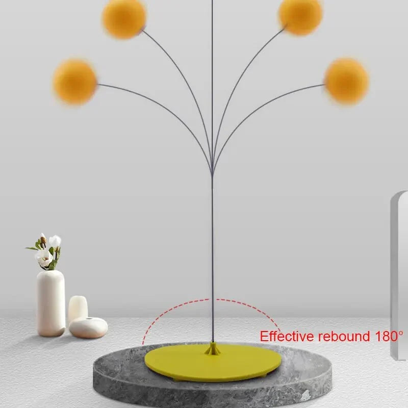 Round base stand with central rod and multiple arcing ball rebound paths