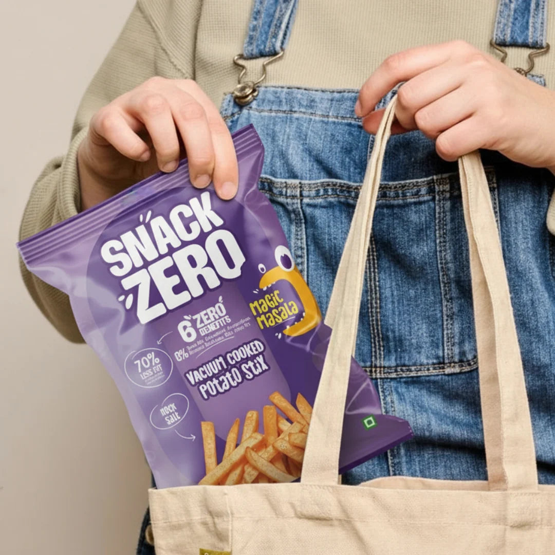 Purple potato stix snack bag held with beige tote over denim jeans