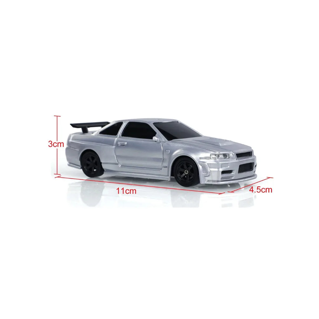 Silver RC drift car with LED lights, drift tires, and remote control racing action.
