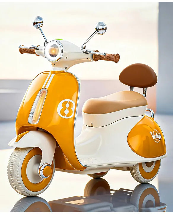 Orange and white kids battery ride-on Vespa scooter with chrome handlebars and beige seat