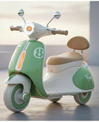Green and white kids battery ride-on Vespa scooter with chrome handlebars and beige seat