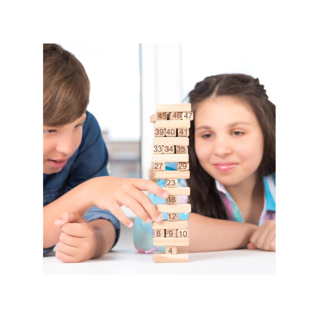 Wooden tumbling tower stacking game with dice for family fun.
