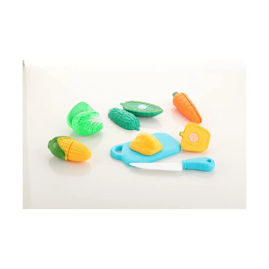 Sliceable vegetable cutting play set with toy knife and board.
