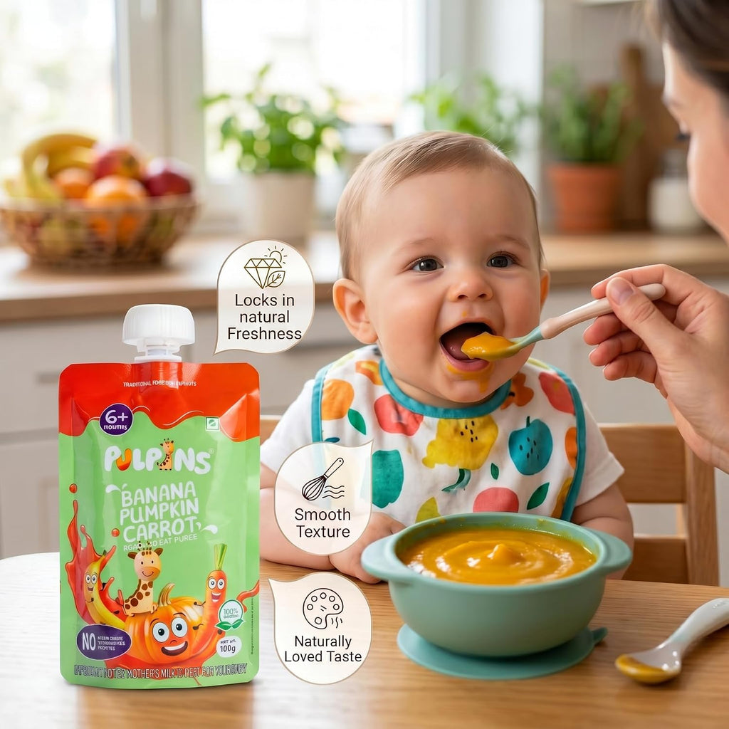 Baby eating puree with spoon beside Banana, Pumpkin, Carrot pouch and bowl
